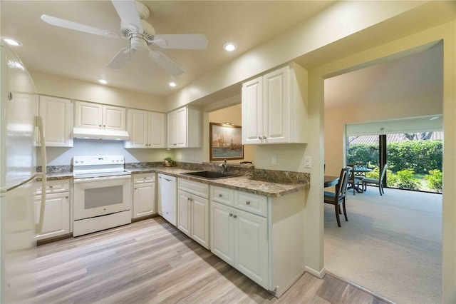 kitchen featuring white cabinetry, white appliances, and sink