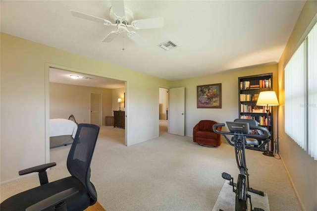 office featuring light carpet and ceiling fan