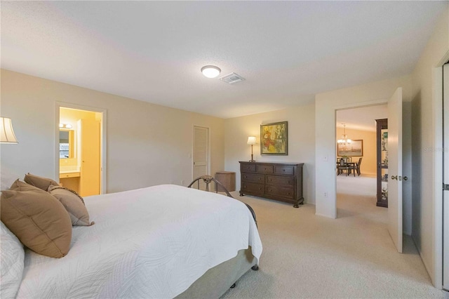 carpeted bedroom featuring connected bathroom