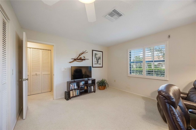 living area with light colored carpet