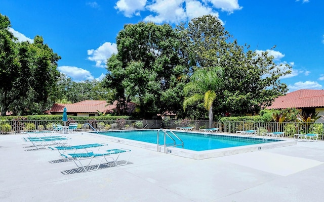 view of swimming pool featuring a patio area