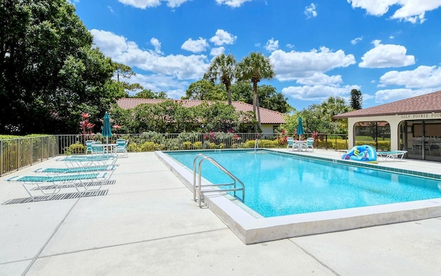 view of swimming pool featuring a patio area