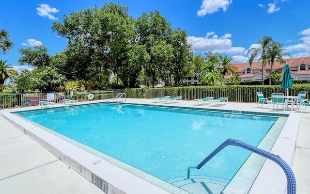 view of swimming pool featuring a patio area