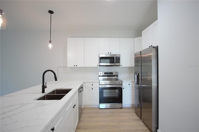 6779 David Blvd, Port Charlotte, FL 33981 - kitchen with stainless steel appliances, white cabinets, and decorative backsplash