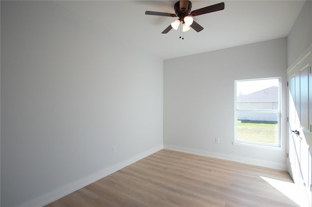 6779 David Blvd, Port Charlotte, FL 33981 - empty room with light wood-style flooring and ceiling fan