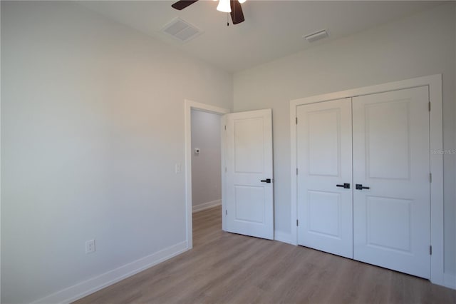 6779 David Blvd, Port Charlotte, FL 33981 - unfurnished bedroom with wood finished floors, a closet, and ceiling fan