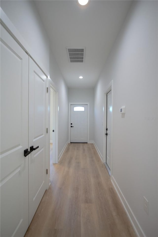 6779 David Blvd, Port Charlotte, FL 33981 - hall featuring light wood-style flooring and baseboards