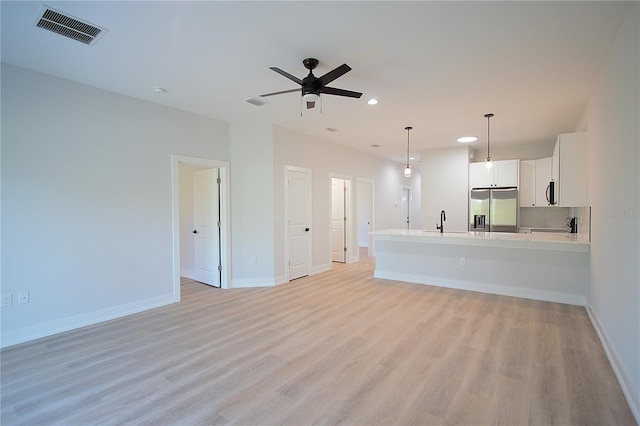 6779 David Blvd, Port Charlotte, FL 33981 - unfurnished living room featuring recessed lighting, light wood-type flooring, and a ceiling fan