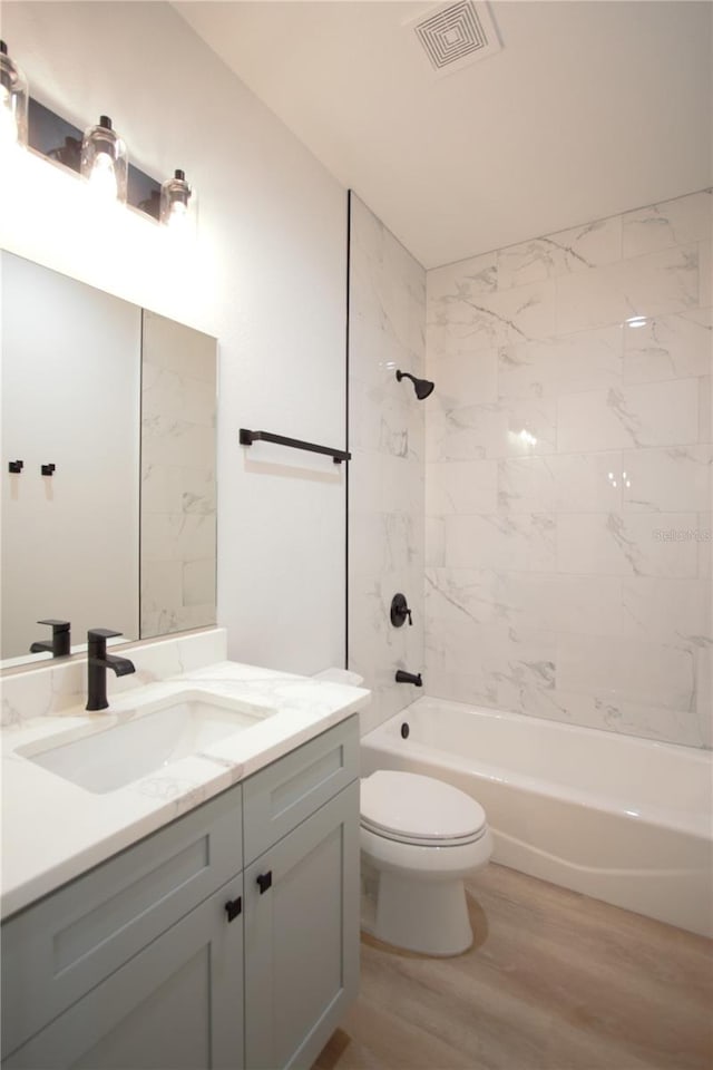 6779 David Blvd, Port Charlotte, FL 33981 - full bathroom with vanity, wood finished floors, and shower / tub combination