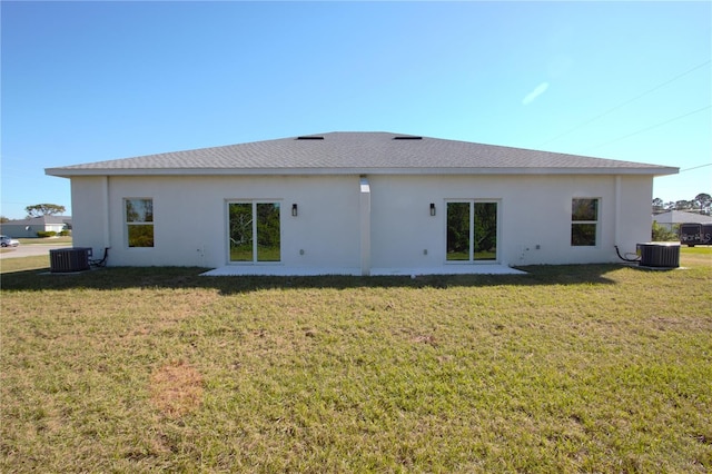 6779 David Blvd, Port Charlotte, FL 33981 - rear view of house featuring a lawn and stucco siding