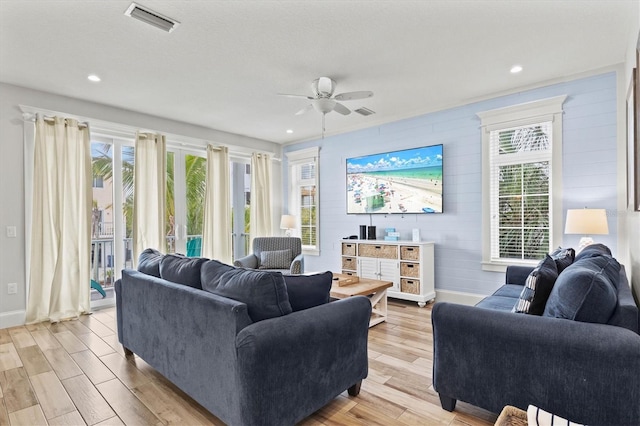 living room featuring ceiling fan