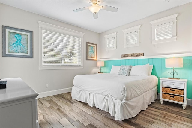 bedroom featuring light hardwood / wood-style floors and ceiling fan