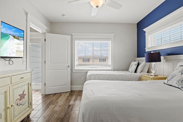 bedroom featuring light hardwood / wood-style flooring and ceiling fan