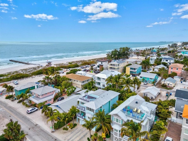 birds eye view of property with a view of the beach and a water view