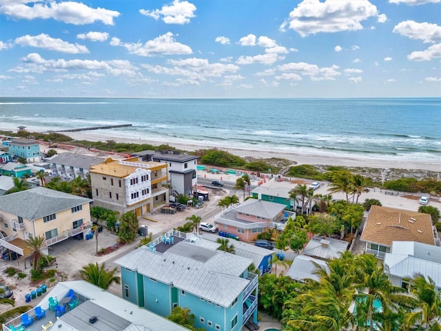 drone / aerial view with a water view and a view of the beach