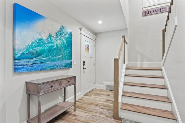 entryway with light hardwood / wood-style floors