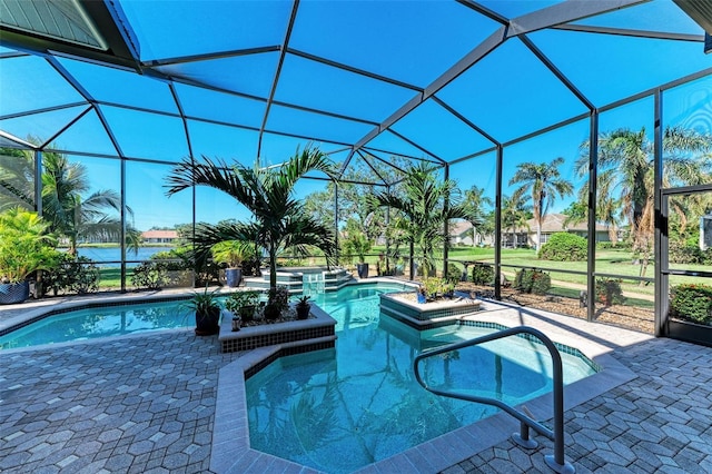 view of swimming pool with glass enclosure, an in ground hot tub, and a patio