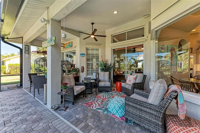 view of patio / terrace featuring an outdoor living space and ceiling fan