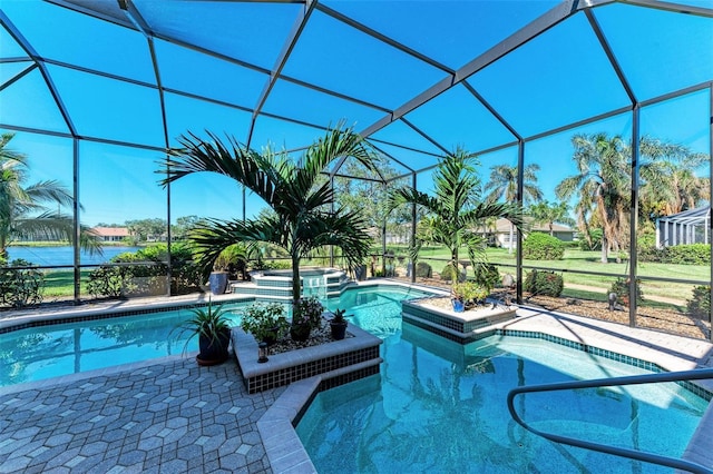 view of pool featuring glass enclosure and an in ground hot tub