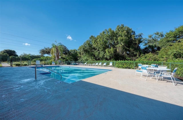 view of swimming pool featuring a patio