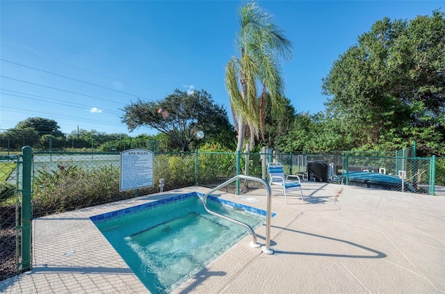 view of pool with a community hot tub