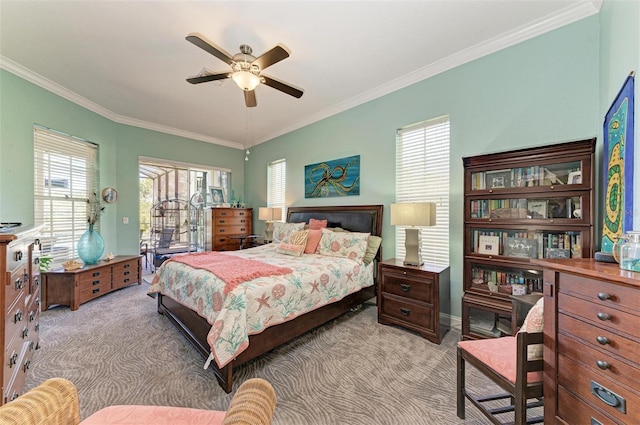 carpeted bedroom featuring multiple windows, ornamental molding, and ceiling fan