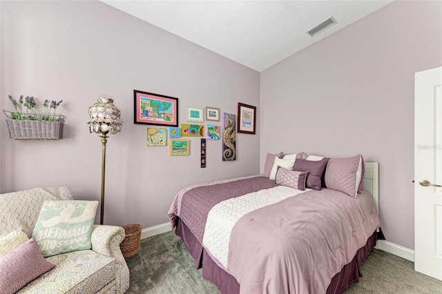 bedroom with carpet floors and lofted ceiling