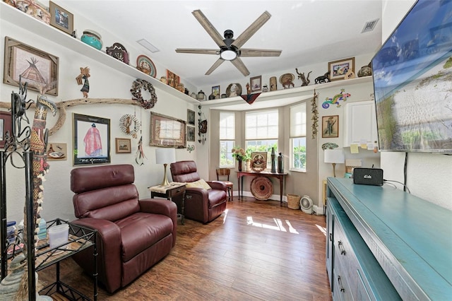 living area featuring ceiling fan and wood-type flooring