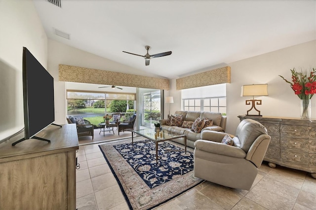 living room featuring ceiling fan and lofted ceiling