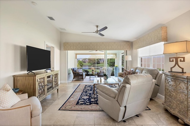 living room with light tile patterned floors, vaulted ceiling, a wealth of natural light, and ceiling fan