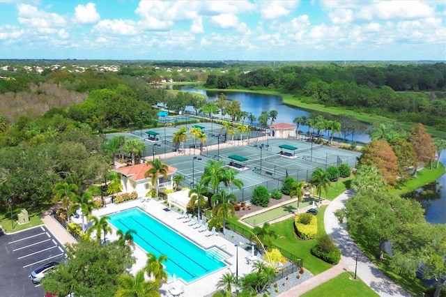 birds eye view of property with a water view