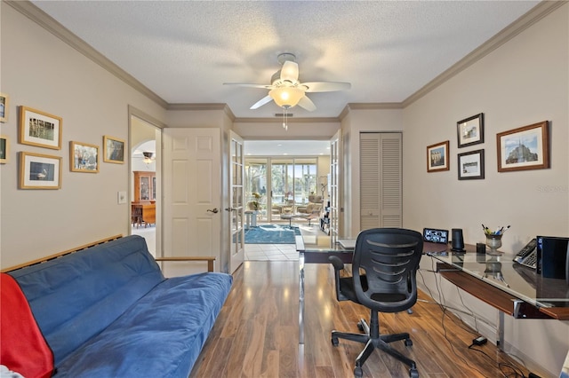 office space featuring wood-type flooring, a textured ceiling, and ceiling fan