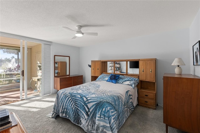 bedroom featuring carpet flooring, ceiling fan, a textured ceiling, and access to outside