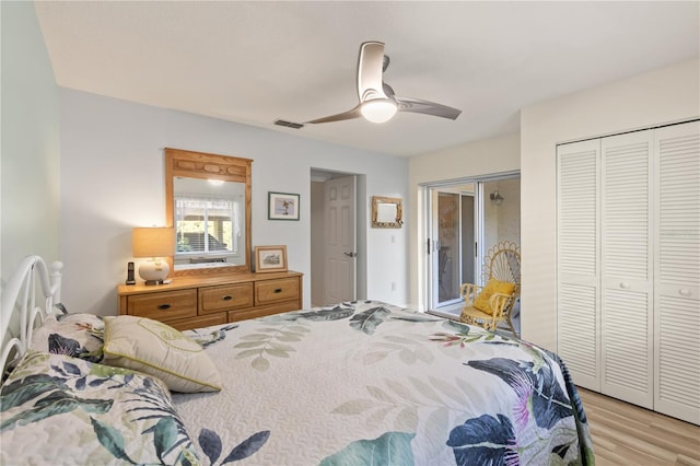 bedroom with light hardwood / wood-style flooring and ceiling fan