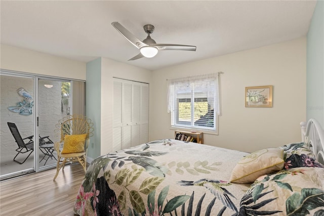 bedroom featuring access to outside, light wood-type flooring, a closet, and ceiling fan