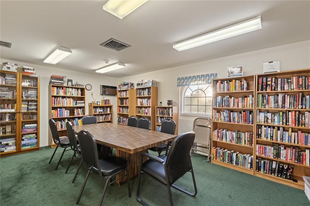 office area featuring dark colored carpet