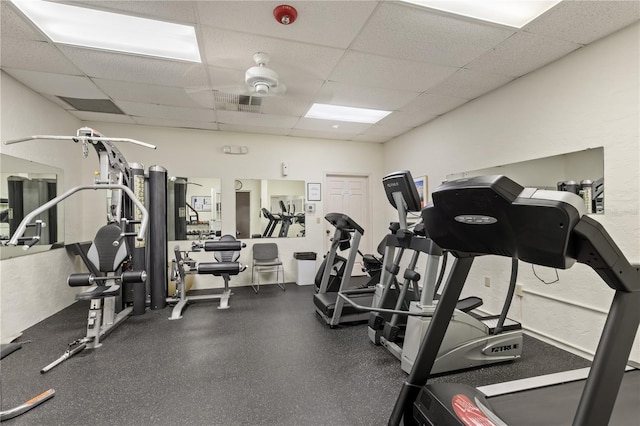 gym featuring a drop ceiling