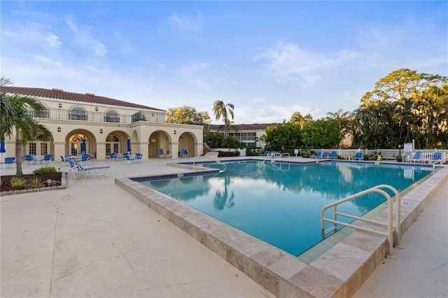 view of pool featuring a patio