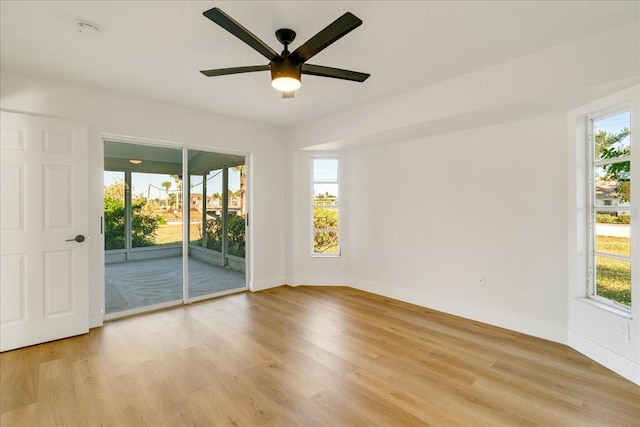 spare room with ceiling fan and light hardwood / wood-style floors