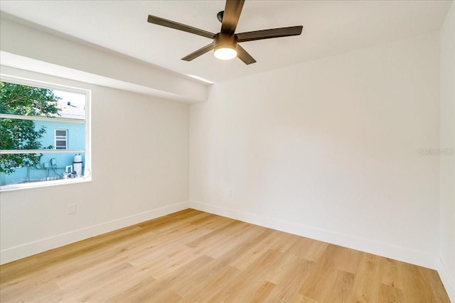 spare room with ceiling fan and hardwood / wood-style floors