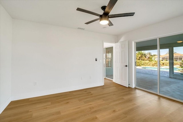 spare room featuring ceiling fan and light wood-type flooring