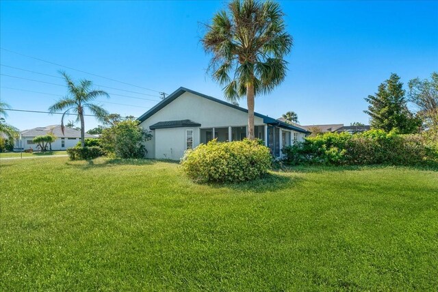 view of home's exterior with a lawn