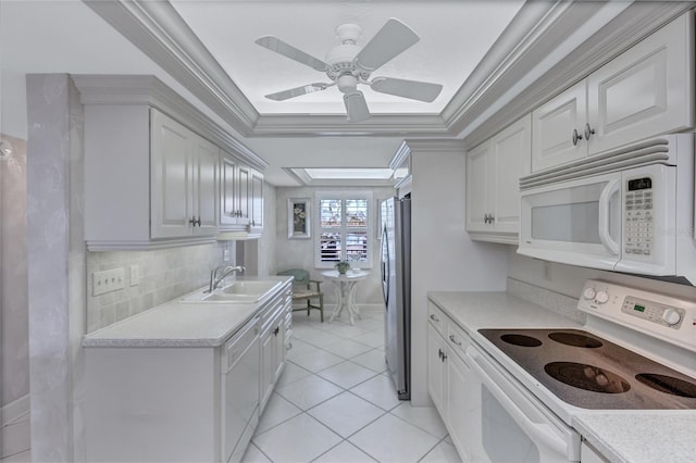 kitchen with white cabinets, white appliances, crown molding, and sink