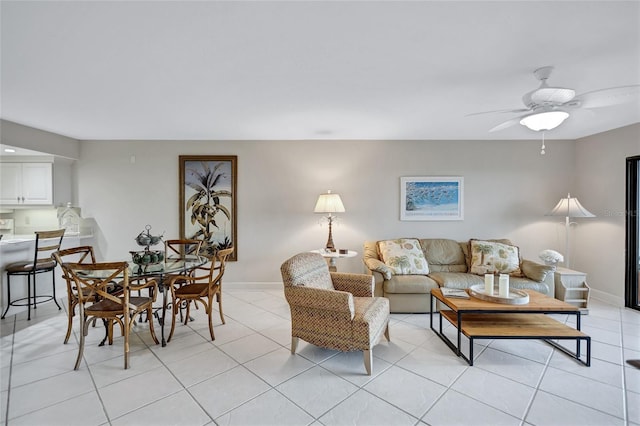 tiled living room with ceiling fan