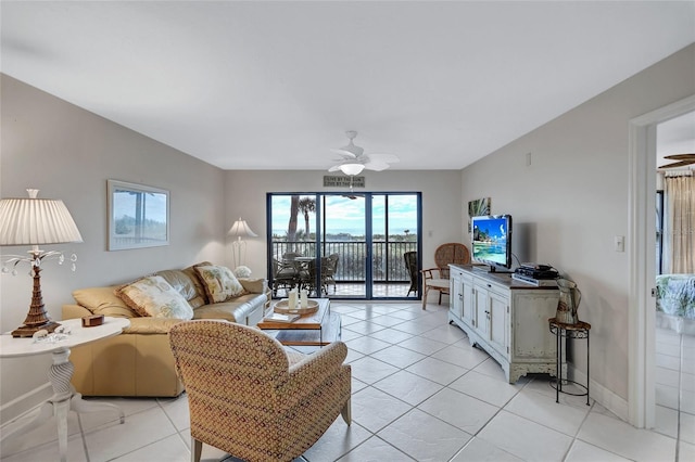 tiled living room featuring ceiling fan