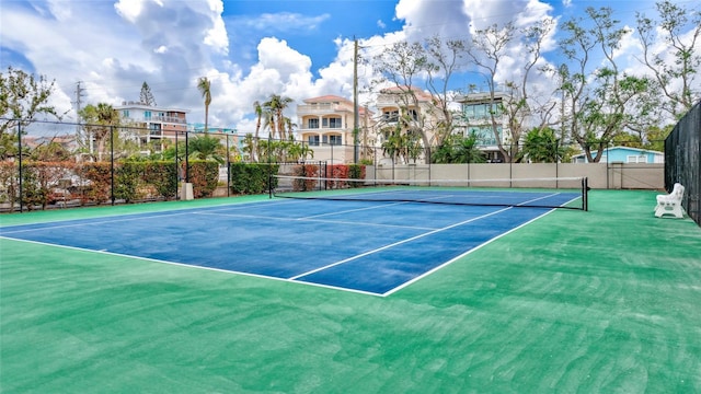 view of sport court with basketball hoop