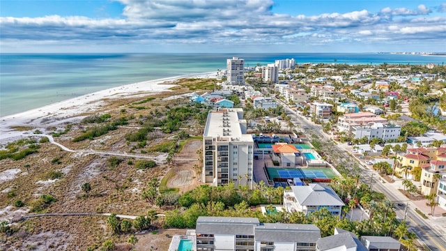 birds eye view of property featuring a view of the beach and a water view