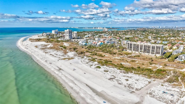 bird's eye view featuring a water view and a view of the beach