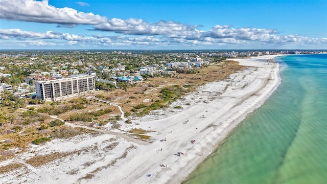 aerial view with a water view and a beach view