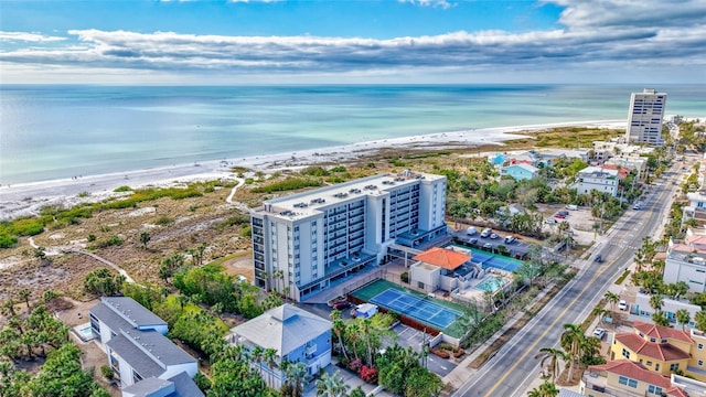 bird's eye view featuring a water view and a beach view